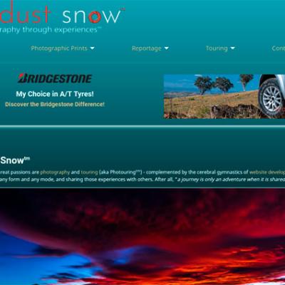 Website design for Red Dust Snow photography featuring a teal layout and outback landscape photography